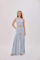 Labeca Polly Dusty Blue Linen Open Flare Pants laid flat showing the wide-leg design and lightweight fabric.