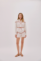 Labeca Colette linen tie shirt in ecru and red, showing the stylish collar and front detail of this elegant linen top.