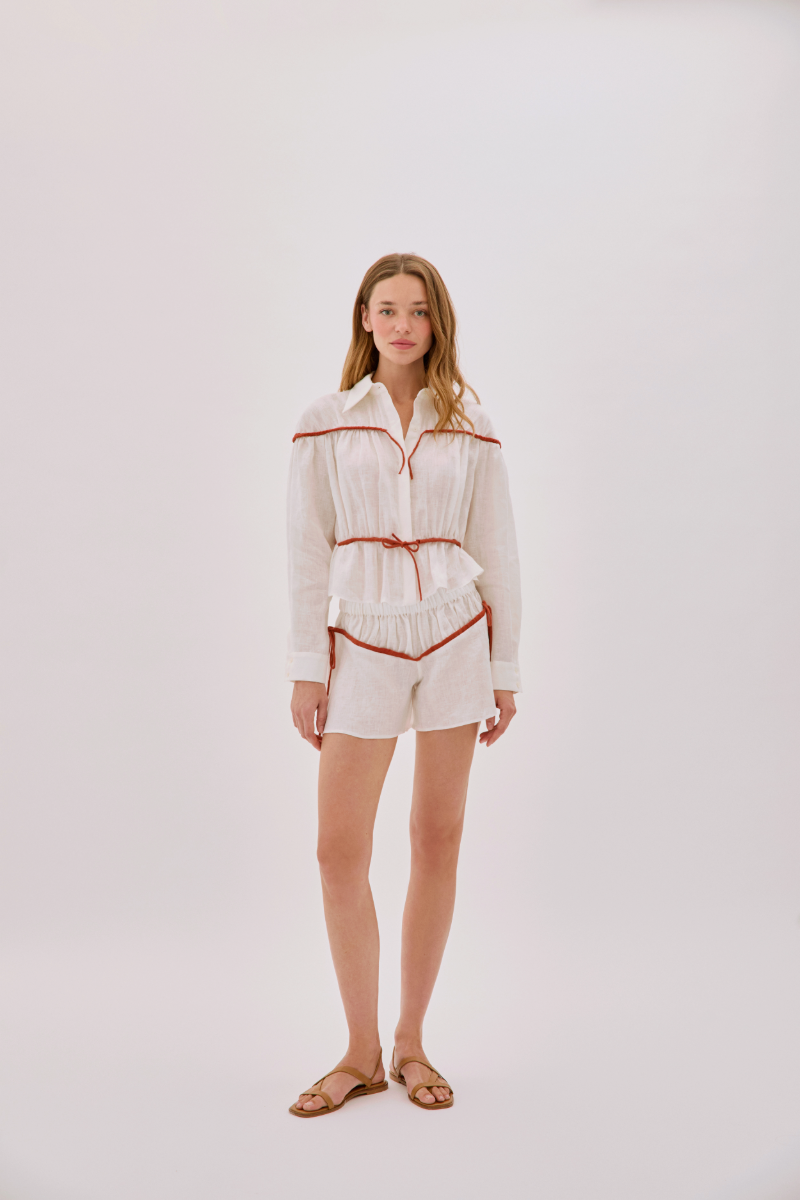 Labeca Colette linen tie shirt in ecru and red, showing the stylish collar and front detail of this elegant linen top.