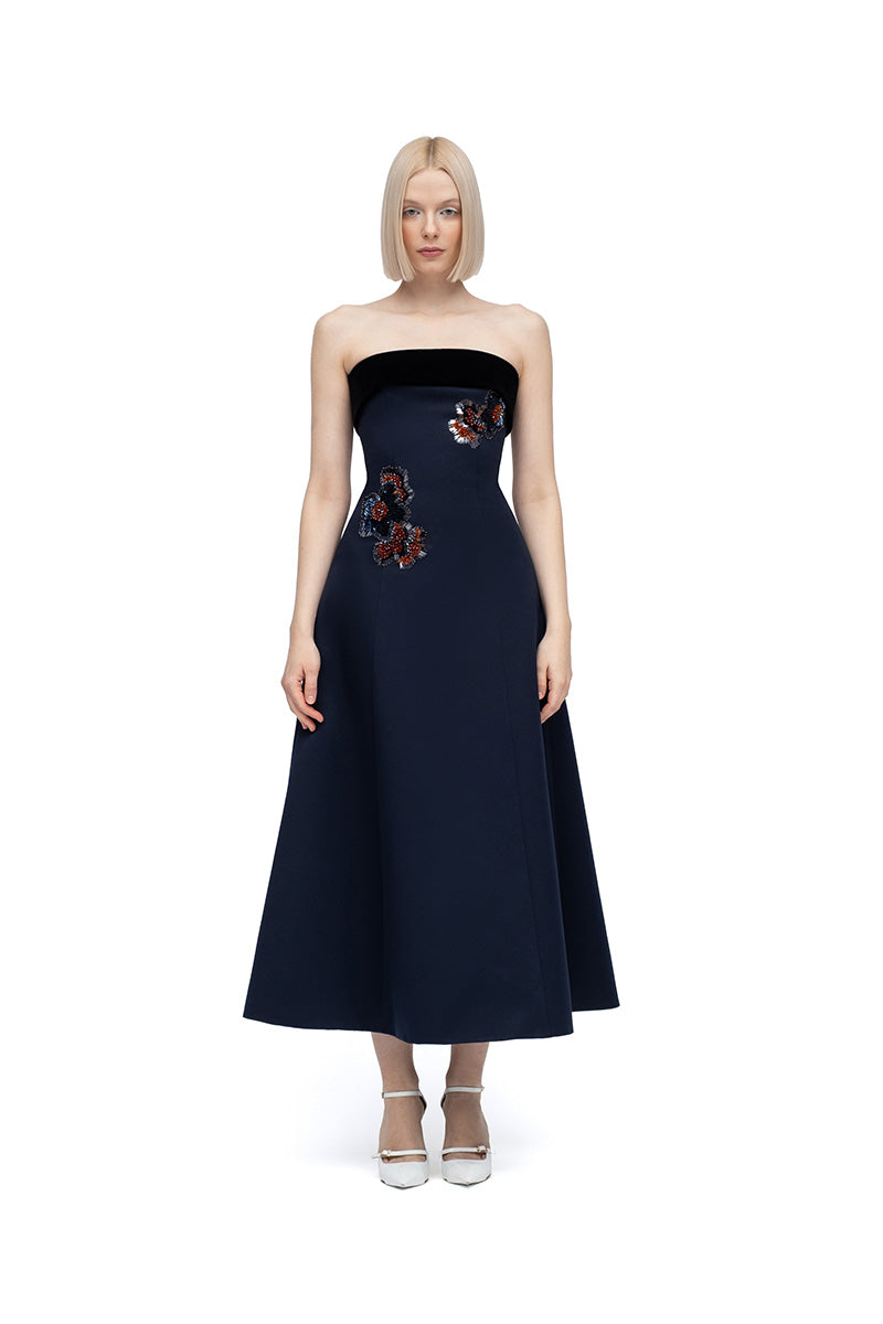 Moon Menekse midi dress in navy and black with a fitted bodice and flowing skirt, showcasing stylish elegance.