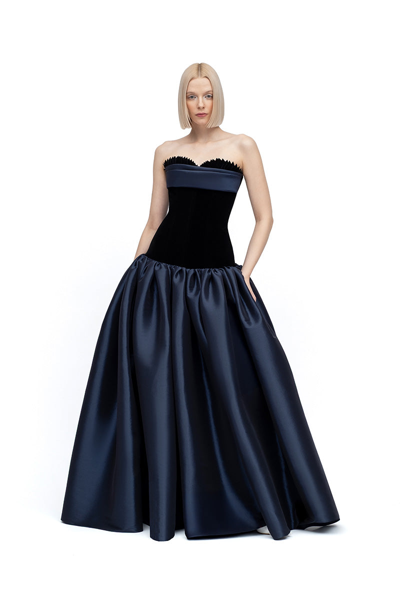 Black and navy Marina maxi dress by MOON / HAKAN YILDIRIM, featuring flowing fabric and elegant design, shown on a model.