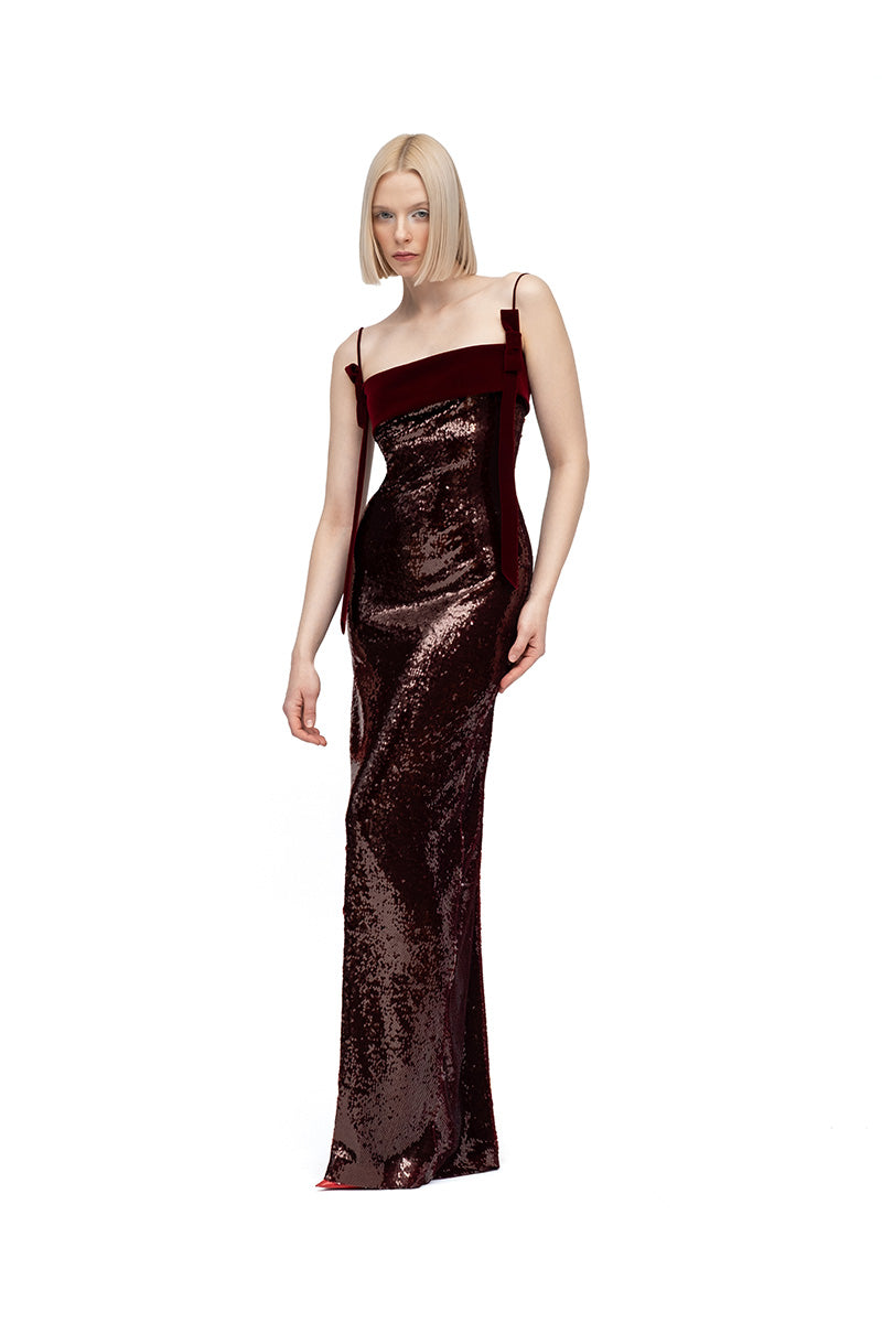Elegant burgundy and wine maxi dress by MOON / HAKAAN YILDIRIM, featuring flowing fabric and stylish design, shown on a model.