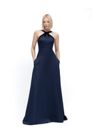 Elegant navy gown by MOON / HAKAAN YILDIRIM, featuring flowing fabric and sophisticated design, perfect for formal occasions.