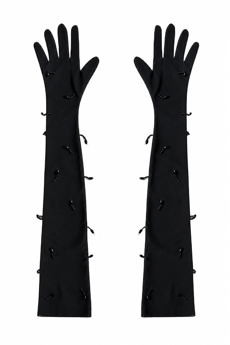 Black Lilia Gloves by Moon / Hakaan Yildirim, close-up of stylish black gloves with sleek design and smooth fabric texture.