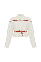 Labeca Colette linen tie shirt in ecru and red with a classic collar and button-down front, displayed on a hanger.