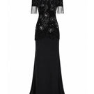 Elegant Raishma Felicity gown featuring intricate lace details and flowing fabric, perfect for formal occasions.