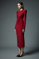 Red LEKIEU Valencia maxi dress displayed on a hanger with flowing fabric and elegant design.