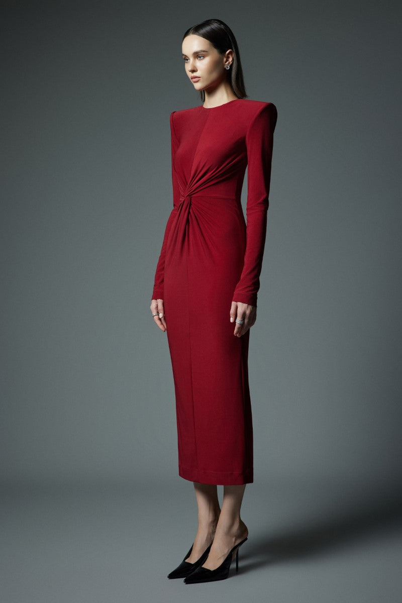 Red LEKIEU Valencia maxi dress displayed on a hanger with flowing fabric and elegant design.