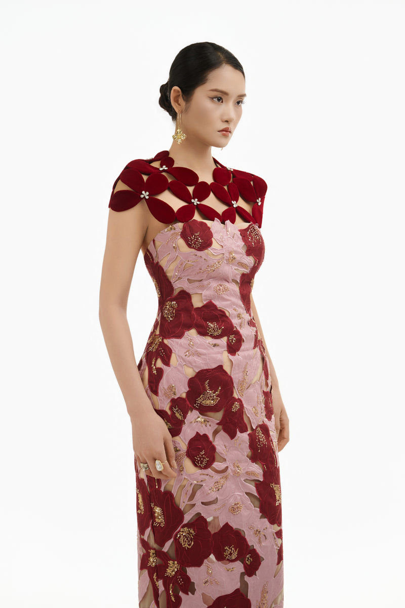Elegant rose petal couture column gown by Happy Clothing featuring flowing fabric and intricate detailing.