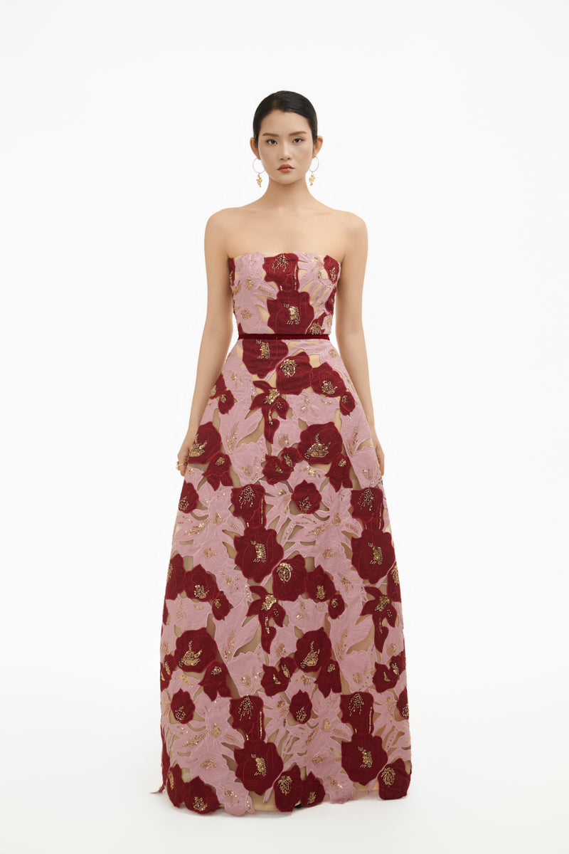 Elegant rose petal strapless gown by Happy Clothing, featuring flowing fabric and a fitted bodice for formal occasions.