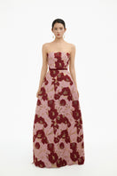 Elegant rose petal strapless gown by Happy Clothing featuring flowing fabric and a fitted bodice for formal occasions.
