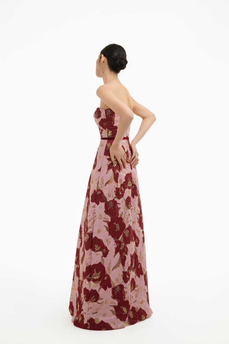 Elegant rose petal strapless gown by Happy Clothing, flowing fabric with a fitted bodice and soft floral details.