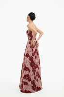 Elegant rose petal strapless gown by Happy Clothing, flowing fabric and floral design perfect for formal occasions.