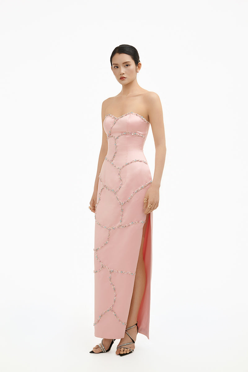 Elegant blush crystal wave strapless gown by Happy Clothing, featuring a flowing design and shimmering details.