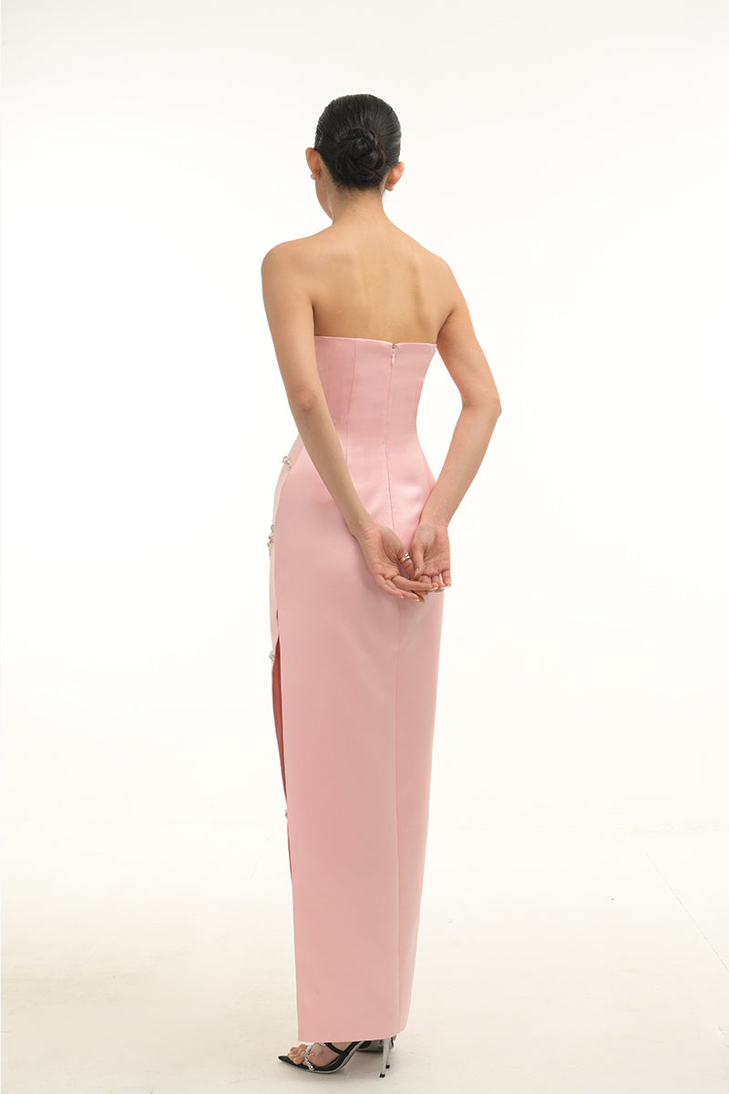 Elegant blush crystal wave strapless gown by Happy Clothing, featuring flowing fabric and intricate crystal detailing.