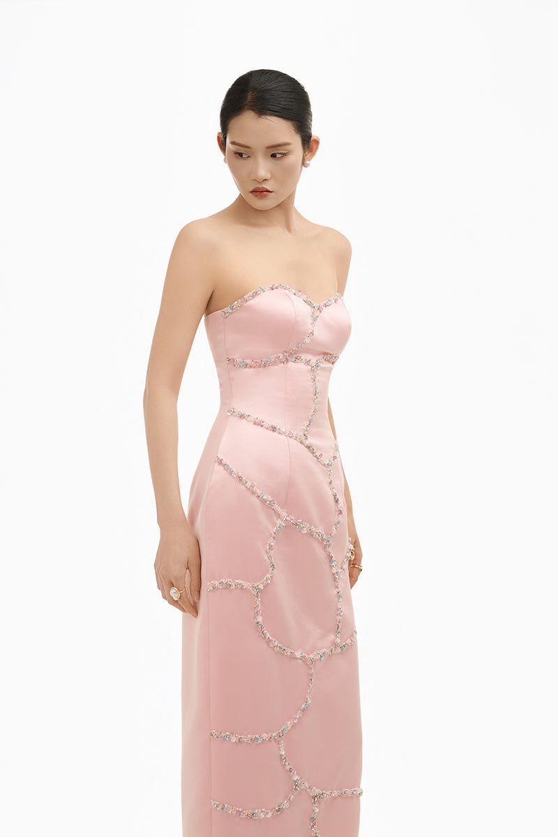 Elegant blush crystal wave strapless gown by Happy Clothing, featuring flowing fabric and intricate crystal detailing.