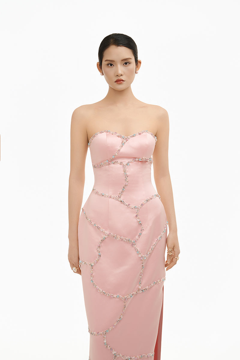 Elegant blush crystal wave strapless gown by Happy Clothing, flowing fabric with intricate crystal detailing and a sleek, modern design.