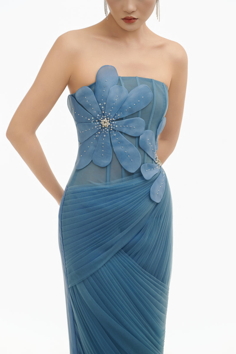 Blue 3D floral draped maxi gown by Happy Clothing, featuring flowing fabric and intricate floral details in a stylish design.