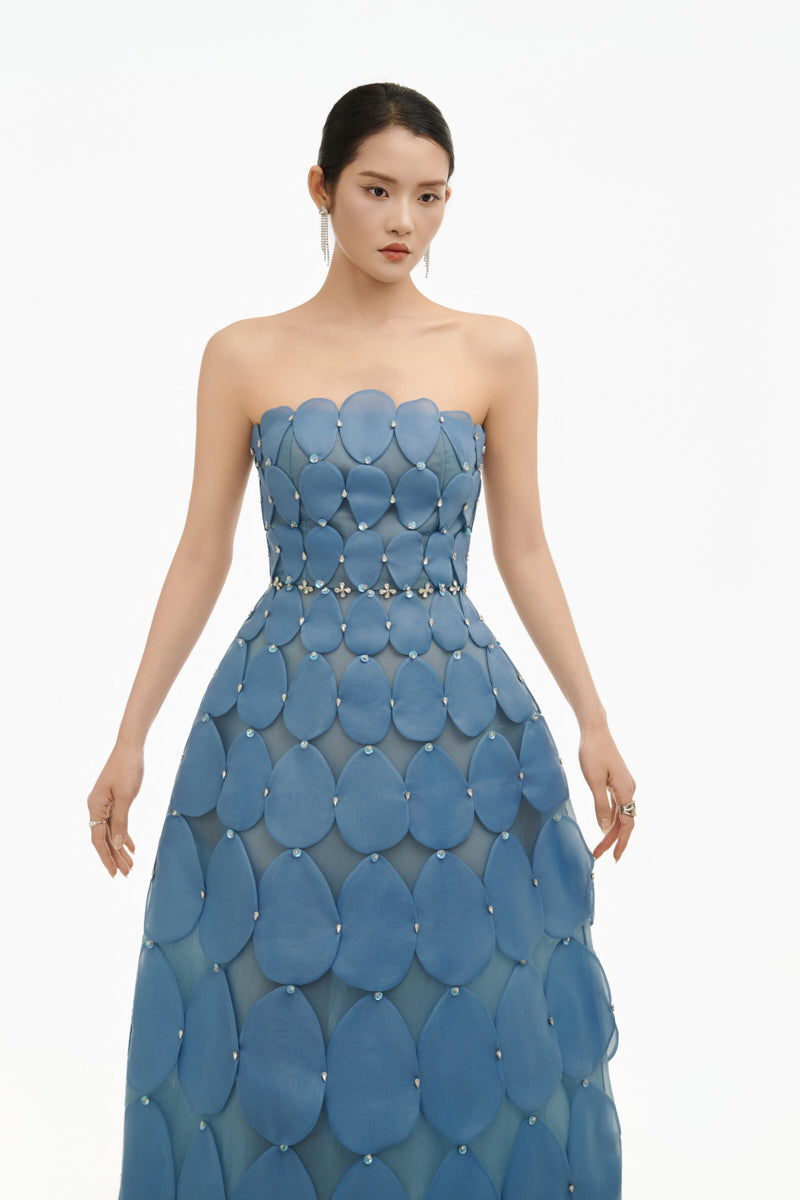 Blue 3D petal sculpture maxi gown by Happy Clothing, flowing fabric with intricate petal detailing, perfect for elegant occasions.
