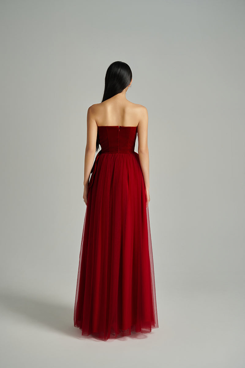 Red floral velvet and organza gown by Happy Clothing, featuring intricate design and flowing fabric for elegant occasions.