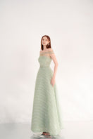 Light mint off-shoulder organza maxi gown by Happy Clothing, flowing fabric with elegant off-shoulder design and delicate detailing.