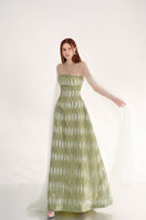 Elegant dusty mesh gown with embellishments and cape from Happy Clothing, featuring intricate details and flowing design.