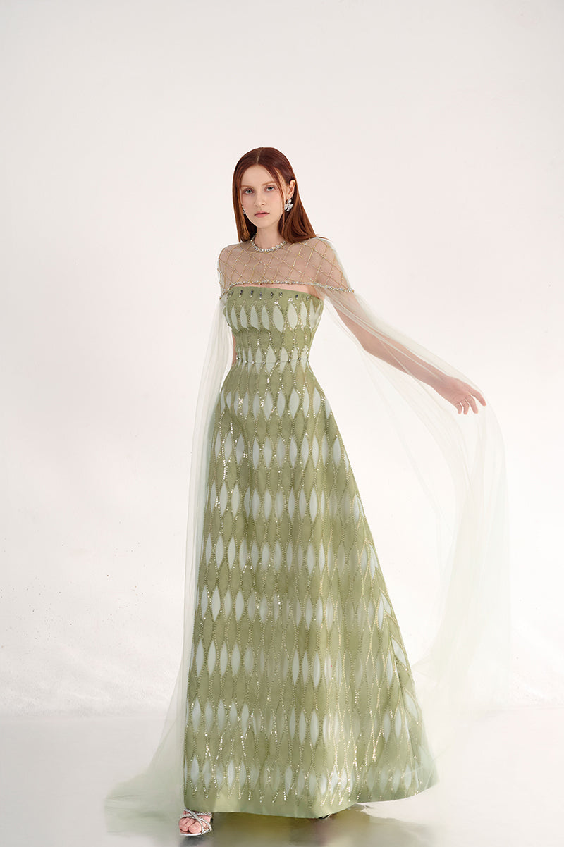 Elegant dusty mesh gown with embellishments and cape from Happy Clothing, featuring intricate details and flowing design.