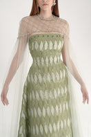 Elegant dusty mesh gown with embellishments and cape by Happy Clothing, showcasing intricate design and flowing fabric.