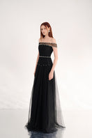 Black off-shoulder organza gown by Happy Clothing featuring flowing fabric and elegant design, perfect for formal occasions.