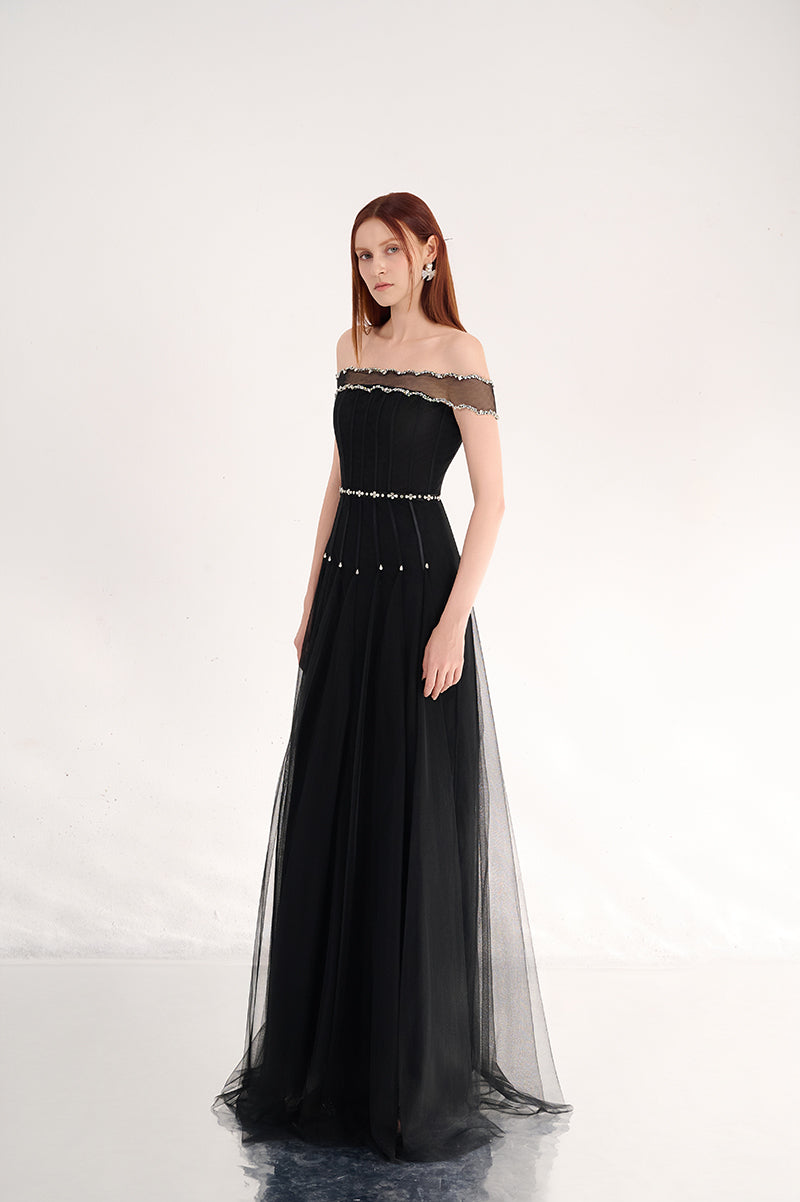 Black off-shoulder organza gown by Happy Clothing featuring flowing fabric and elegant design, perfect for formal occasions.