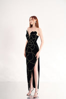 Black velvet strapless gown with a V-neck and petal detail from Happy Clothing, showcasing a flowing, elegant design.