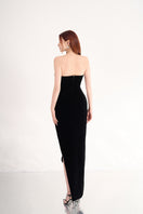 Black velvet V-neck strapless gown with petal details by Happy Clothing, featuring a flowing, elegant design for formal occasions.