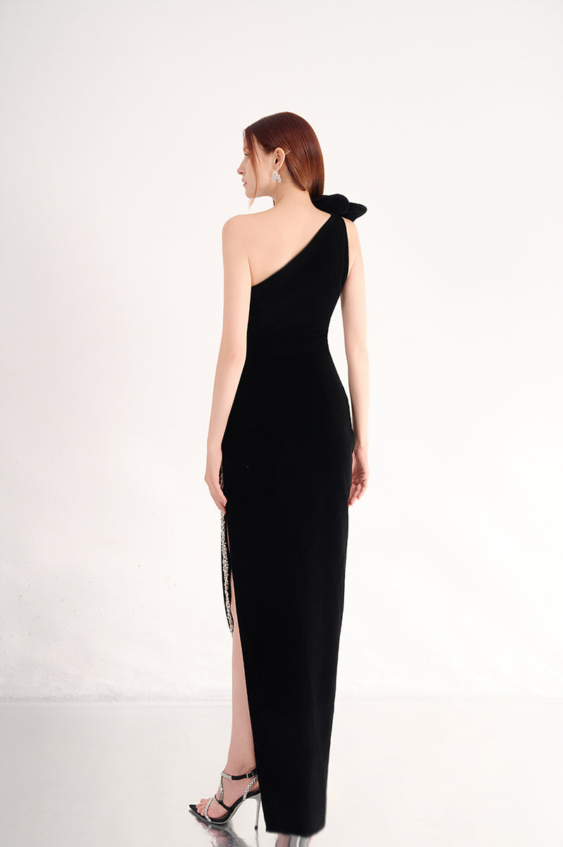 Elegant one-shoulder velvet gown by Happy Clothing with floral details, showcased on a model in a stylish pose.