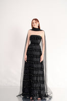 Black strapless floor-length gown with stone embellishments and scarf detail by Happy Clothing, elegant evening dress.