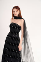 Elegant black strapless gown with stone embellishments and scarf detail by Happy Clothing, floor-length evening dress.