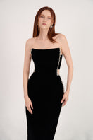 Black velvet maxi dress with stone embellishments, featuring a fitted bodice and flowing skirt, by Happy Clothing.