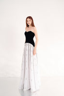 Black and white strapless gown by Happy Clothing, flowing fabric with elegant design, perfect for formal occasions.