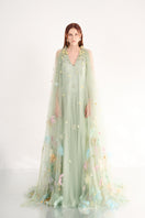 Light mint gown with floral details by Happy Clothing, featuring a flowing fabric and elegant design.