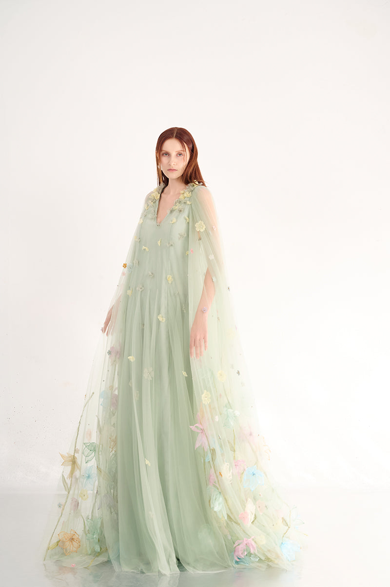 Light mint gown with floral details from Happy Clothing, featuring a flowing fabric and elegant design.