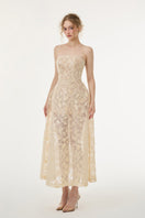 Beige FIORA lace gown by 21Six, showcased on a model with intricate lace details and elegant flowing design.