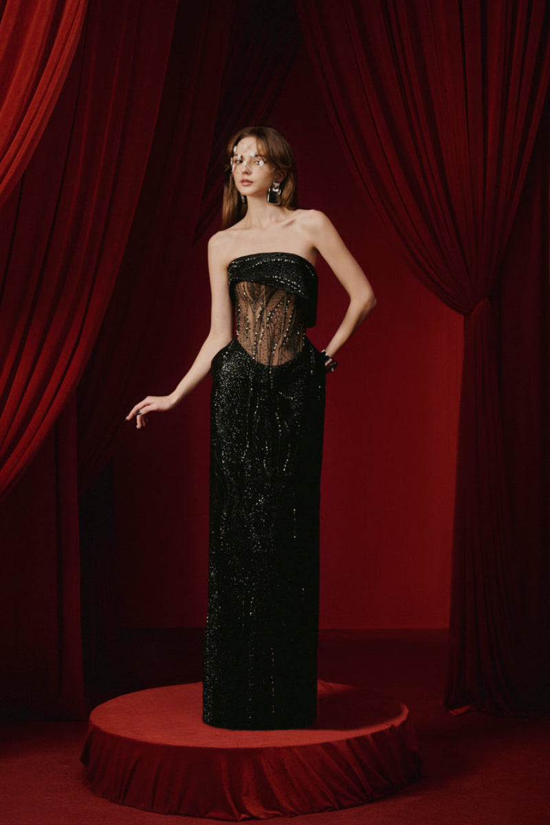 Black Natasha gown by Joséphine, elegant evening dress with flowing fabric and sophisticated design, suitable for formal occasions.