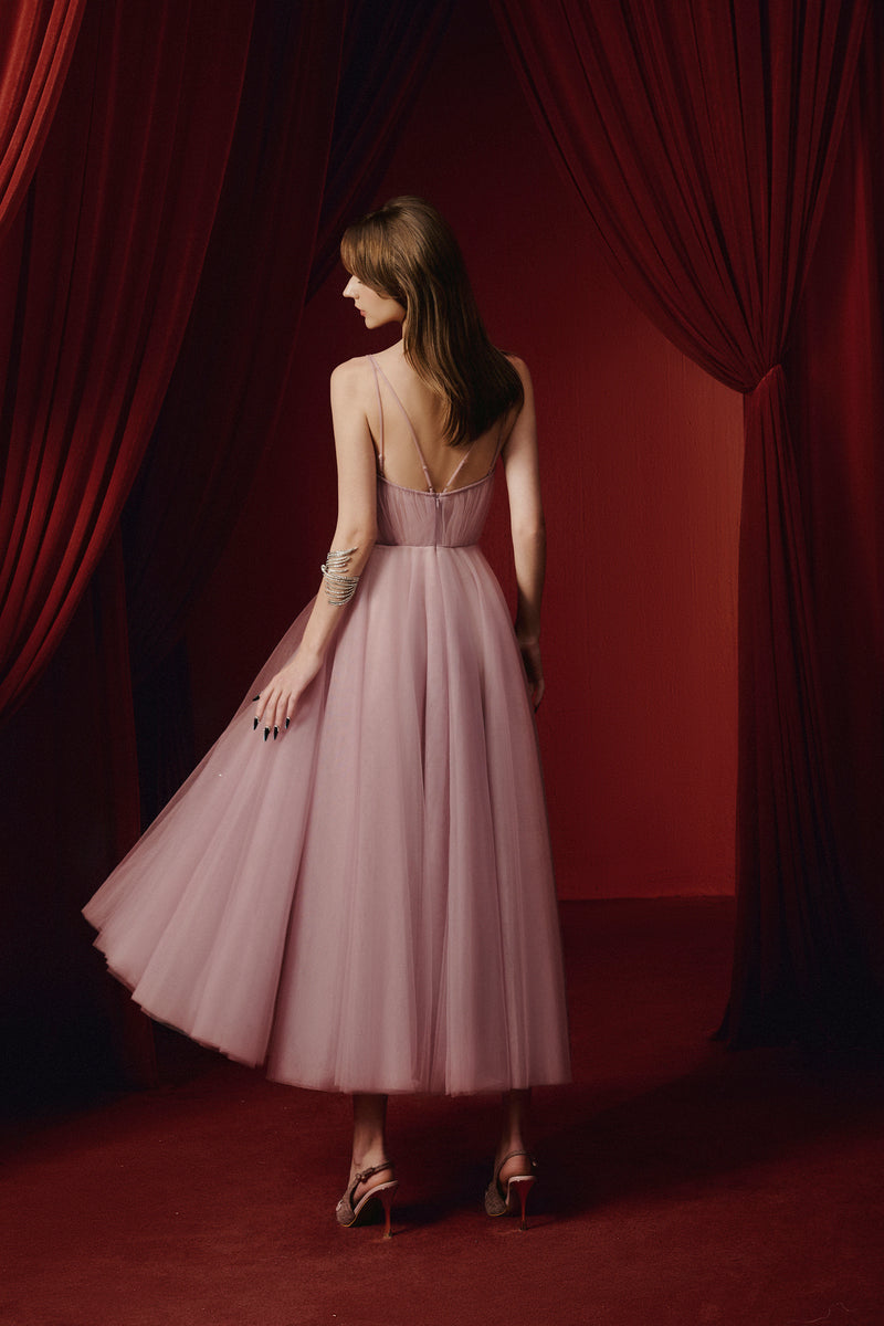 Purple Evelyn gown by JOSÉPHINE featuring elegant fabric, fitted bodice, and flowing skirt in a stylish evening dress.