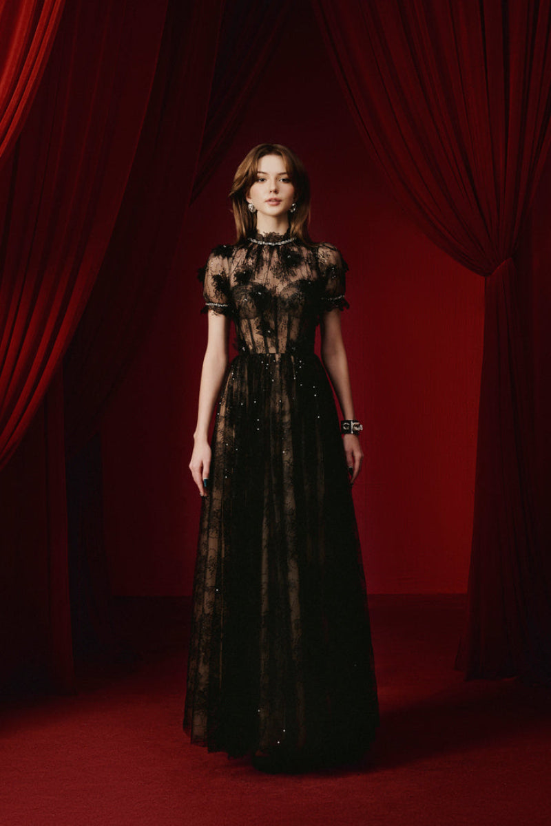 Elegant black YEDDA gown by JOSÉPHINE, featuring a flowing design and sophisticated style, perfect for formal occasions.