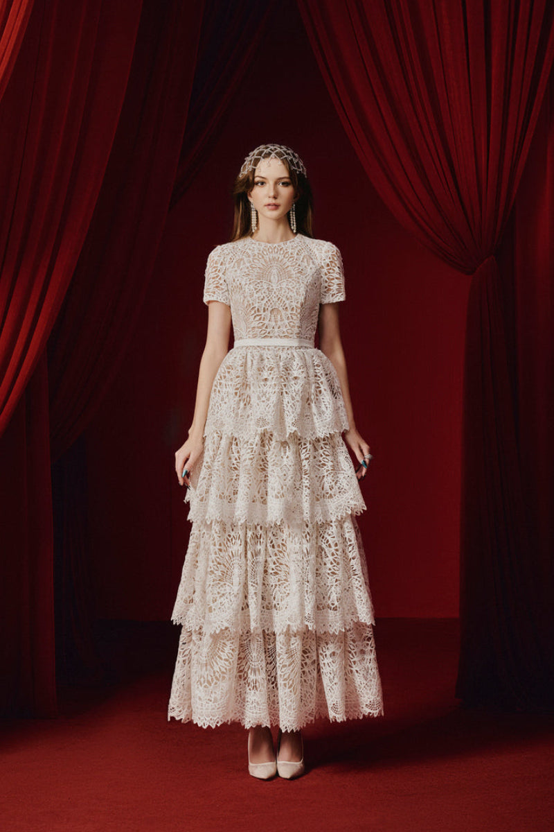 White Rella gown by Joséphine, elegant floor-length dress with flowing fabric and subtle design details.