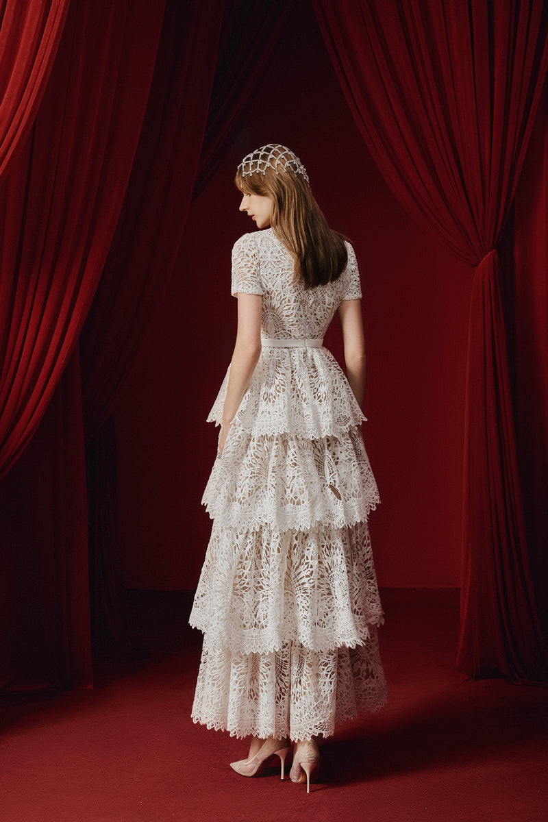 White Rella gown by Joséphine, elegant strapless dress with flowing fabric, perfect for formal occasions.