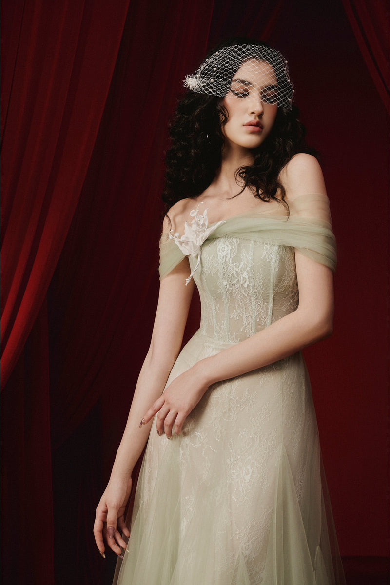 Green TINLEY dress by JOSÉPHINE, elegant gown with flowing fabric and stylish design, shown on a model.