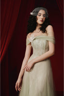 Green TINLEY dress by JOSÉPHINE, elegant gown with flowing fabric and stylish design, shown on a model.
