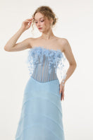 Light blue tulle and organza gown by 21Six, featuring flowing fabric and elegant design, perfect for formal occasions.