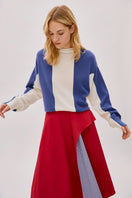 Labeca Keyra red and blue cotton striped midi skirt displayed flat, showcasing its vibrant pattern and lightweight fabric.
