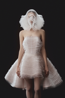 Beaded sleeveless layered bustier mini dress with matching overskirt by Phan Huy, featuring intricate beadwork and stylish design.